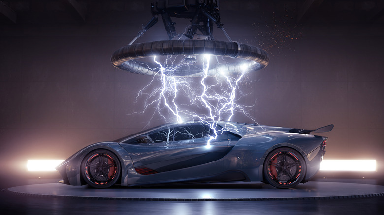 Sports car under a machine sending lightning bolts at it