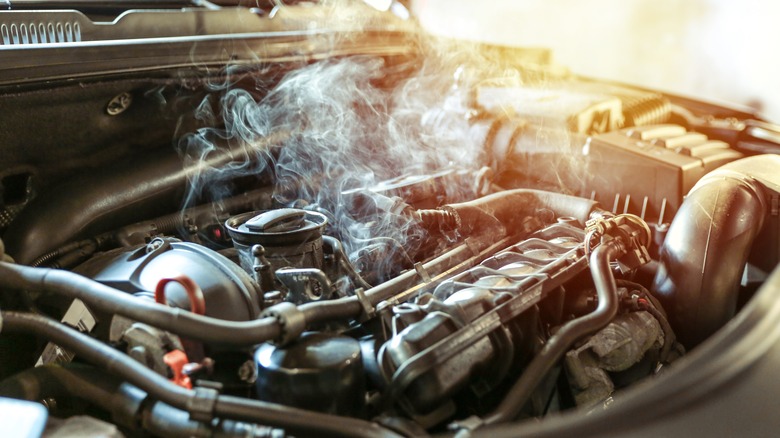 smoke coming out of car engine