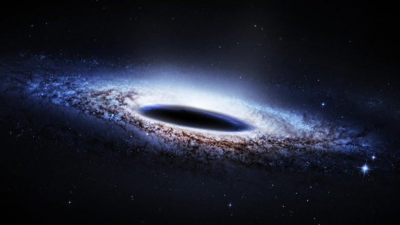 Black hole in space surrounded by a galaxy