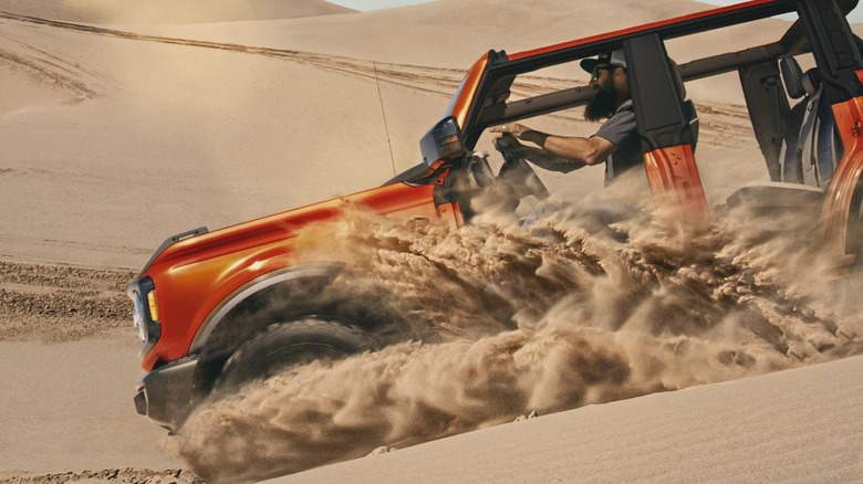 Ford Bronco driving on sand dunes