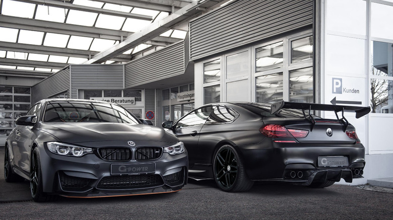 Two black G-Power cars in garage