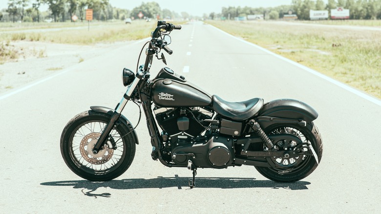 Harley-Davidson Dyna Street Bob parked in middle of road