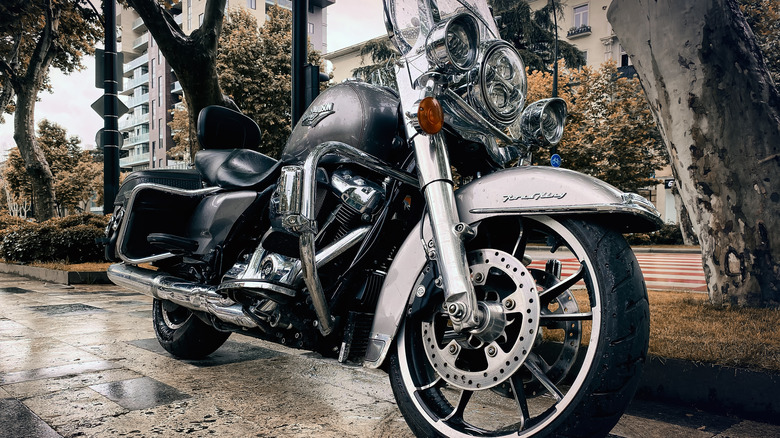 Silver Harley-Davidson parked on a sidewalk