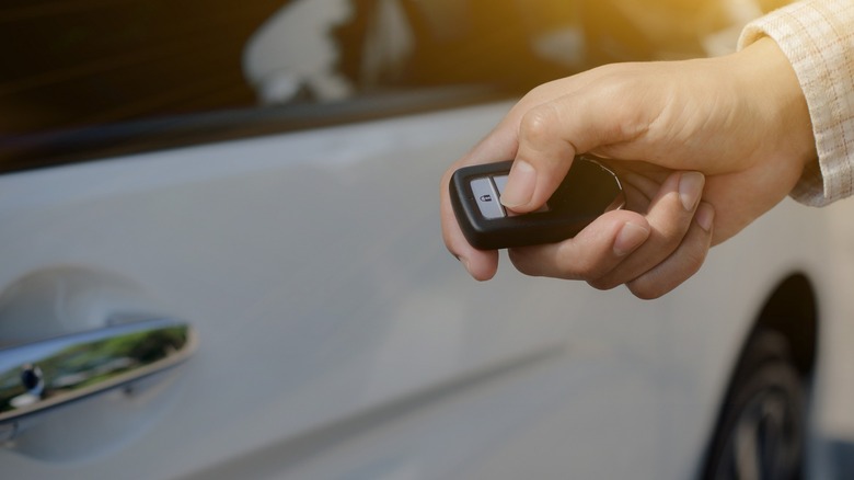 Driver using key fob near car