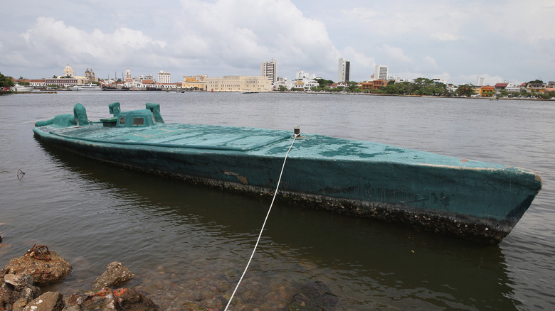 Small vessel tied to the shore