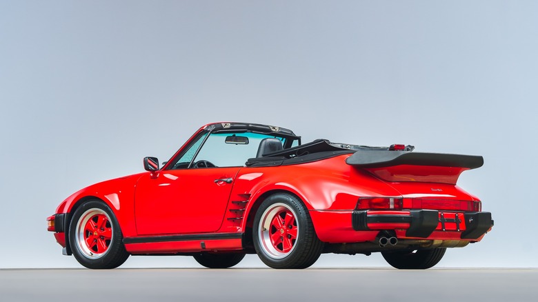 Red Porsche 930 Slantnose showing the rear of the car at an angle