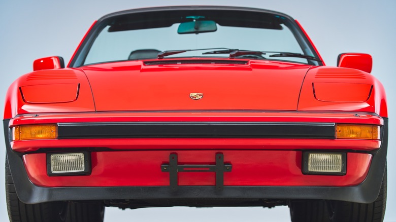 Red Porsche 930 Cabriolet Slantnose showing the front of the car