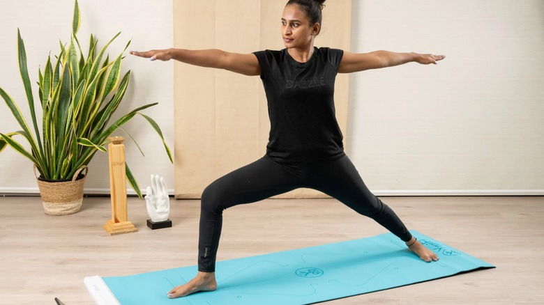 Woman performing yoga on YogiFi mat