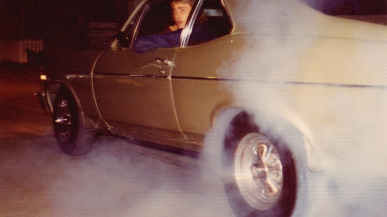 Smoking tires on an old Chevy Nova