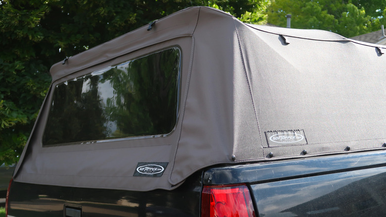 pickup truck with fabric topper on bed