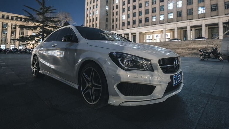 Mercedes car in front of building