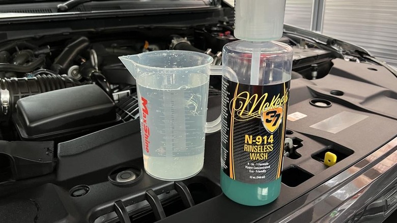 Chemical used in waterless engine wash in front of engine bay