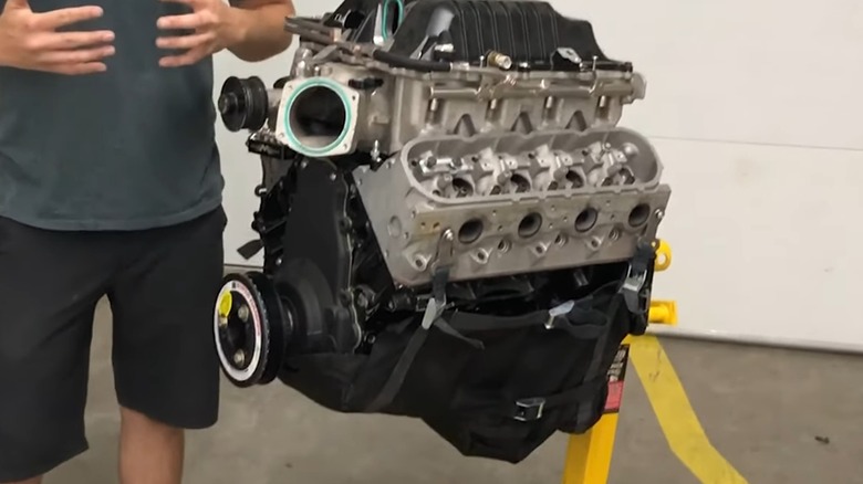 An engine outside of a car, situated in an engine diaper.