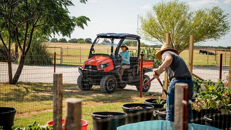 Kubota RTV520 drives on a farm