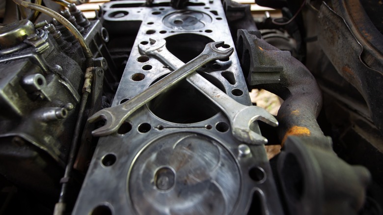 Wrenches on an open engine
