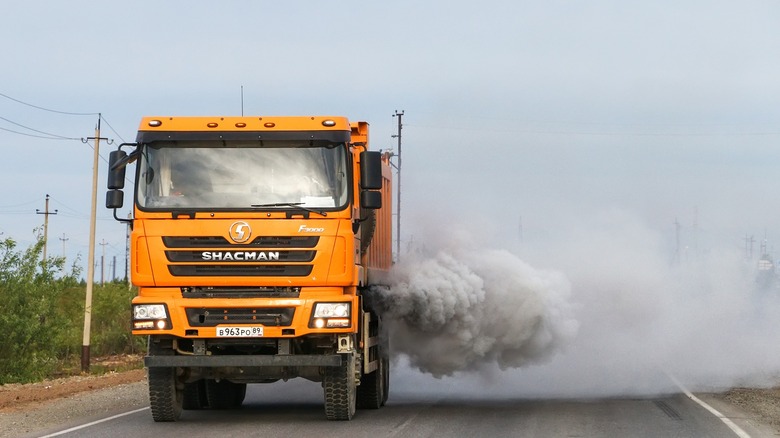 Diesel dump truck puffing smoke