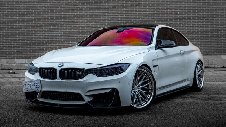 White BMW with chameleon tinted windshield