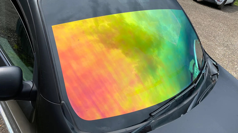 Close up of colorful chameleon tint windshield