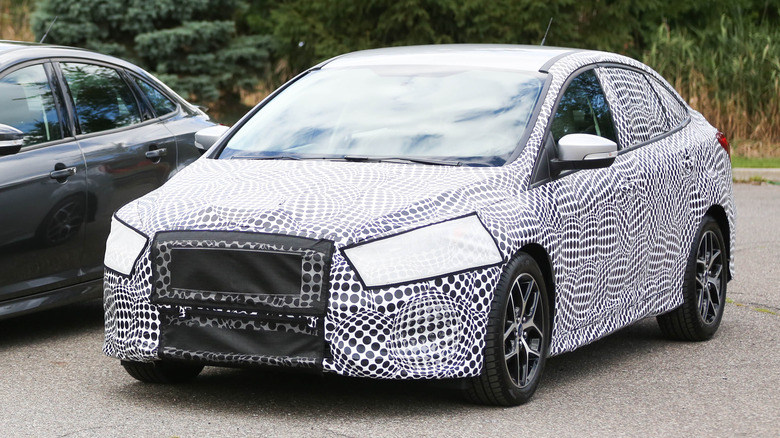 A camouflaged Ford car.