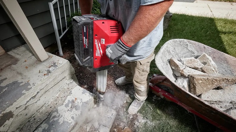 Milwaukee MX Fuel Jackhammer busting concrete