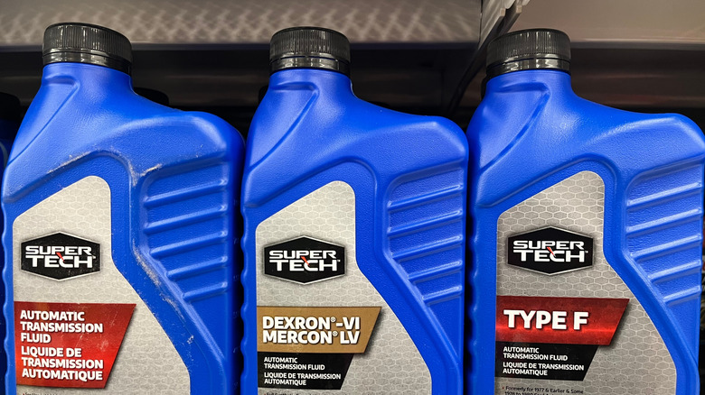 Different automatic transmission fluid types displayed on a shelf