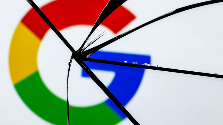 Google logo behind shattered glass