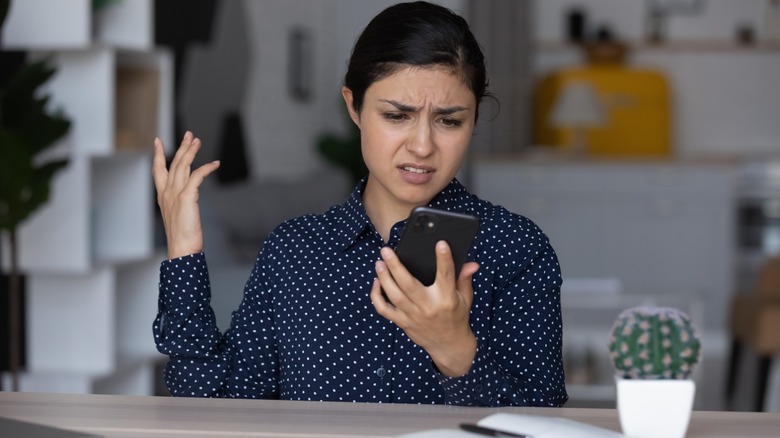 person frustrated at phone