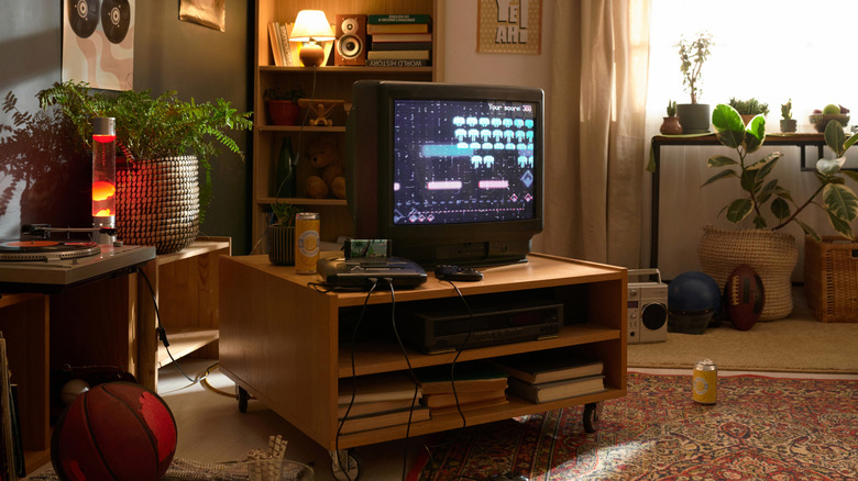 An old CRT TV with a retro console connected