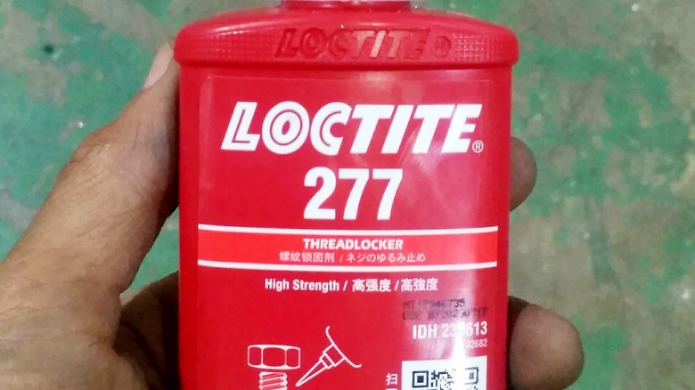 Red Loctite threadlocker bottle