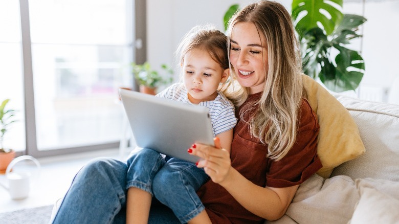 Mom and daughter using tablet