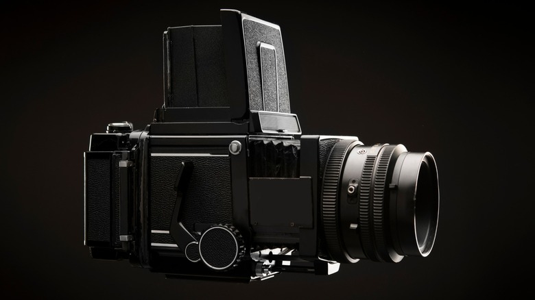 medium format camera on black background