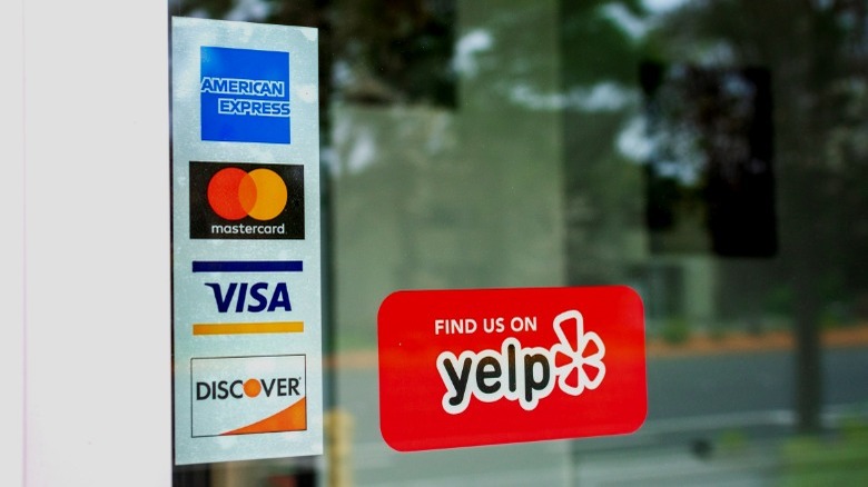 Credit card logos on door