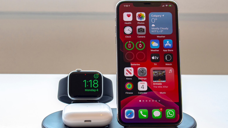 iPhone and an Apple Watch on a wireless charging dock