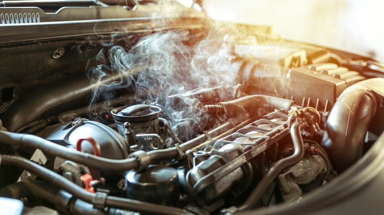 steam pouring out of overheating engine