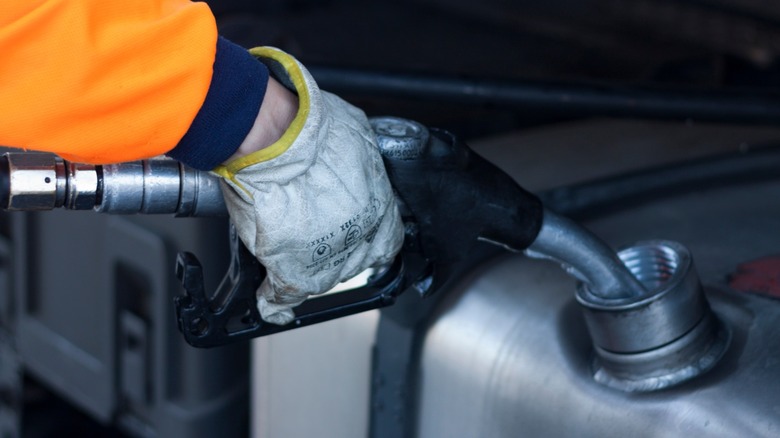 Person refueling gas tank