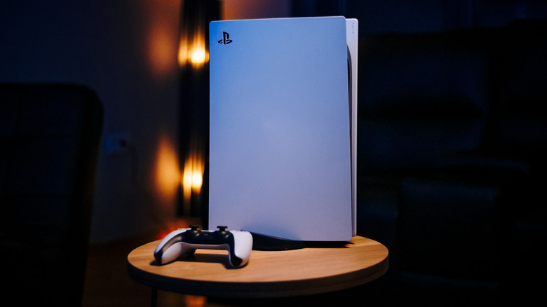 PS5 on a table in a dark room