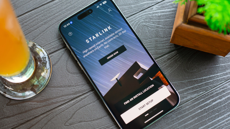 Phone on table with Starlink app open.