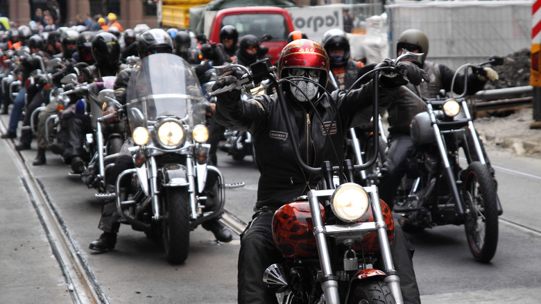 Motorcycle gangs riding together on street