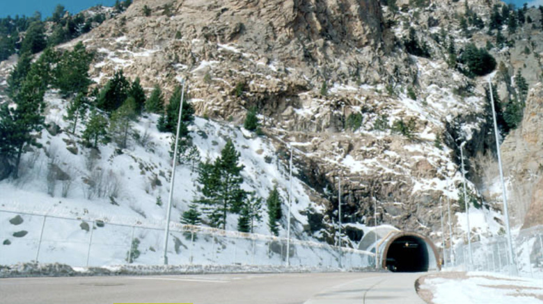 Roadway entrance into a snow covered mountain