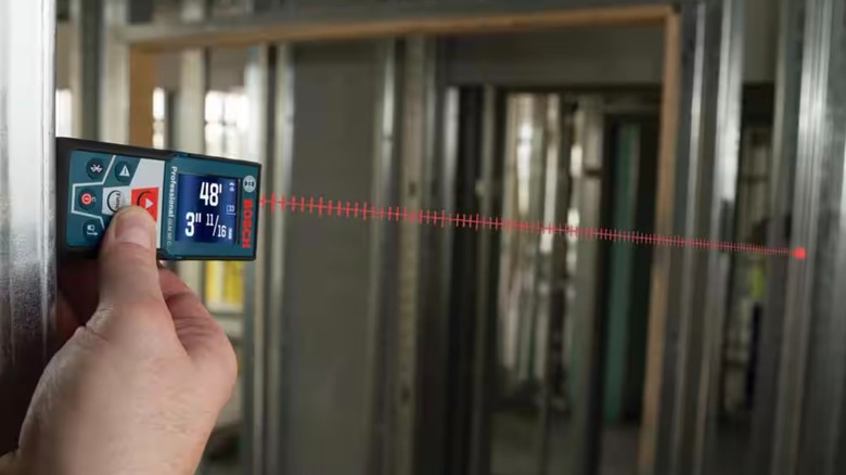 Bosch GLM 50 C Laser Measure in use with illustrated beam