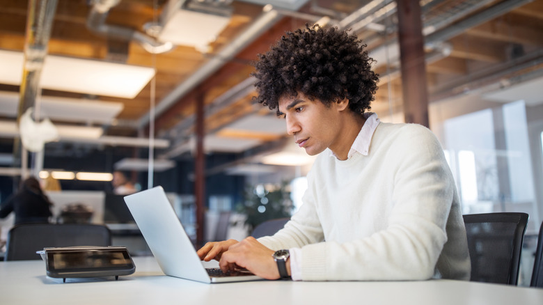 Man focused at work on laptop