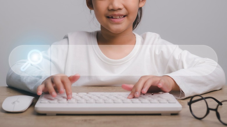 girl searching using keyboard