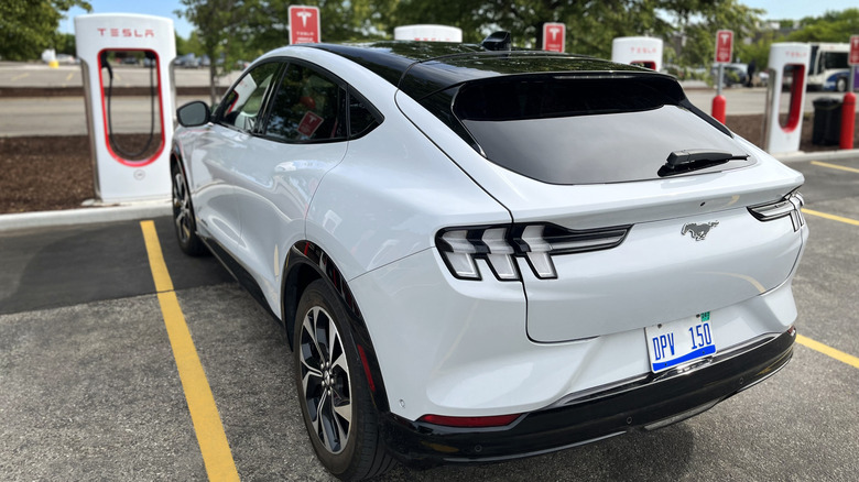 Mustang Mach E parked Tesla Supercharger