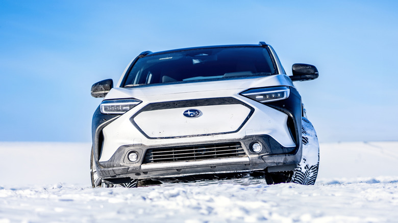 White Subaru Solterra in the snow