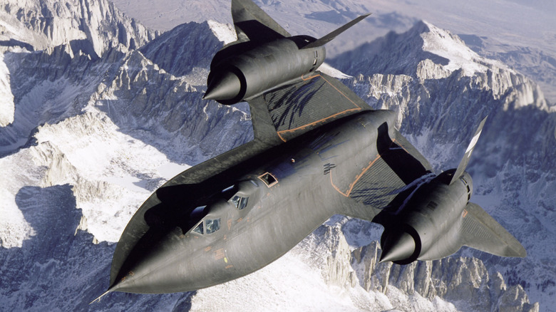 SR-71 flying over snow-capped mountains