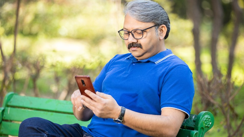 Man using Android phone