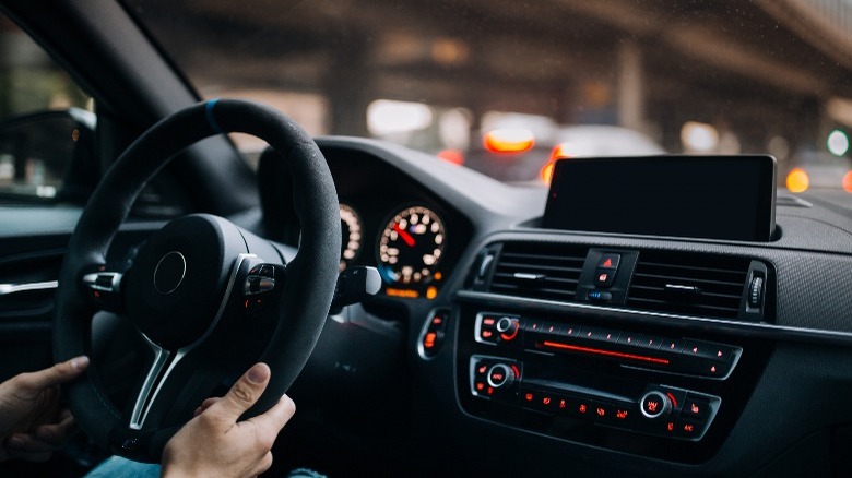 man driving a sports car