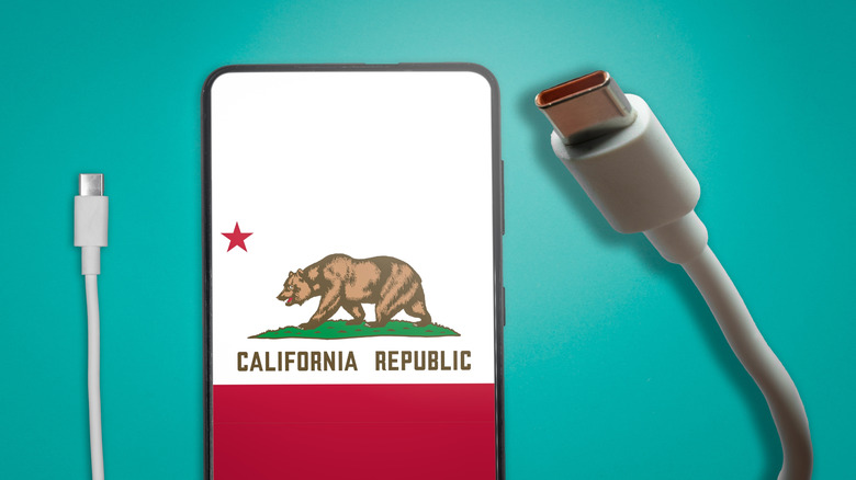 USB Type-C cable next to a smartphone displaying the California flag