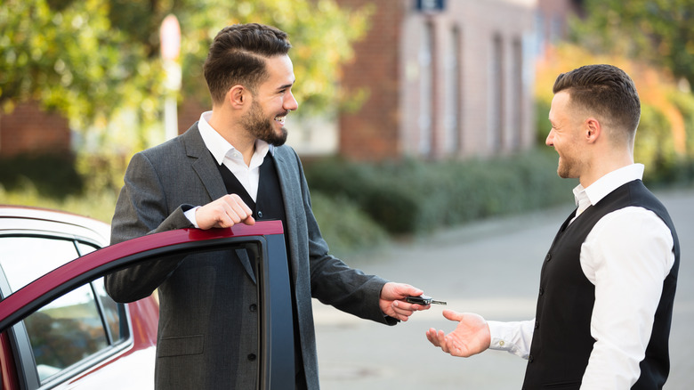 Man giving keys to valet