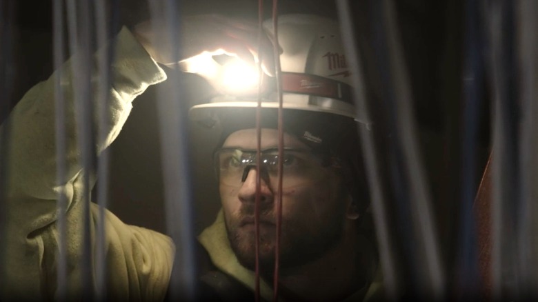 Worker using hard hat light